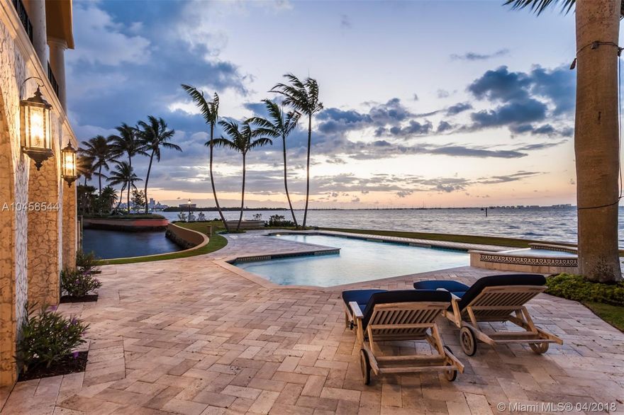 Located in the prestigious community of Hughes Cove, the masterfully designed Italian-inspired European villa emanates an ethereal energy. With over 4,500 SF of covered terraces, each floor delivers astonishing views from South Bay to Downtown, Coconut Grove Harbor and Key Biscayne. The ground floor reflects living on an island with approximately 376 ft. of waterfront. The floor was custom built as part of a hotel in Buenos Aires with a 19th century French hotel-style lobby featuring Italian terrazzo floors. The second floor reflects being on the deck of a ship overlooking open water. The third floor is reminiscent of being in an airplane looking across the water to the horizon. Every detail of the home was carefully selected and quality crafted with no-expense-spared finishes throughout.