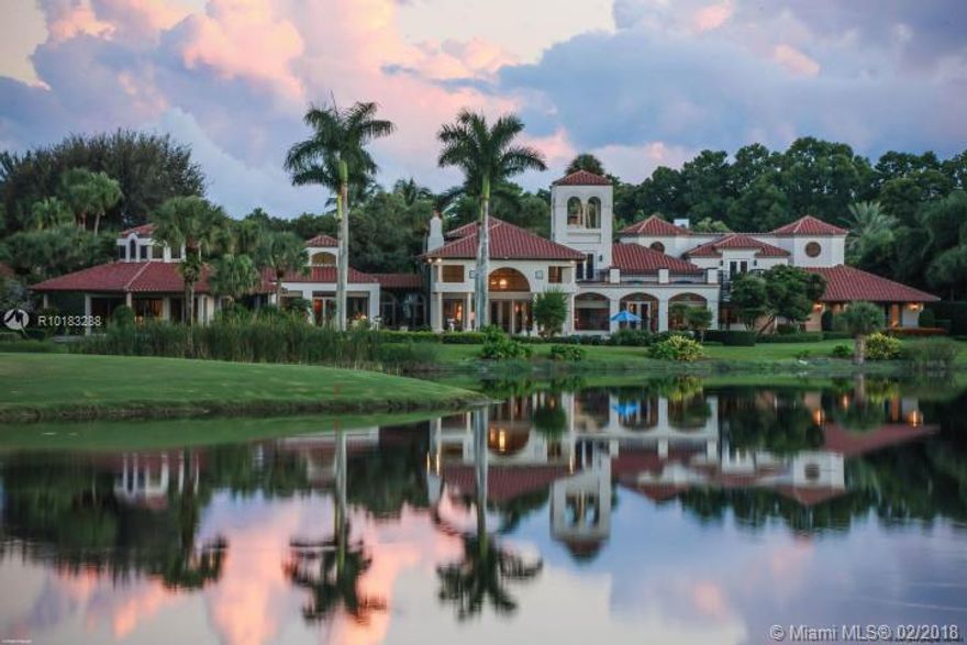 Situated on 2 premier lots with over over one acre of exquisite property, this spectacular estate presents truly panoramic views of the lake and fairways beyond. Boasting nearly 12,000 square feet of actual living space on one story and offering 7 bedrooms and 8.5 baths, this home is truly a compound. Located on a private cul-de-sac, with just over 300' of lake frontage and offering exquisite details throughout from a circular drive to the porte-cochere entrance and elegant, old French Castle doors, to an