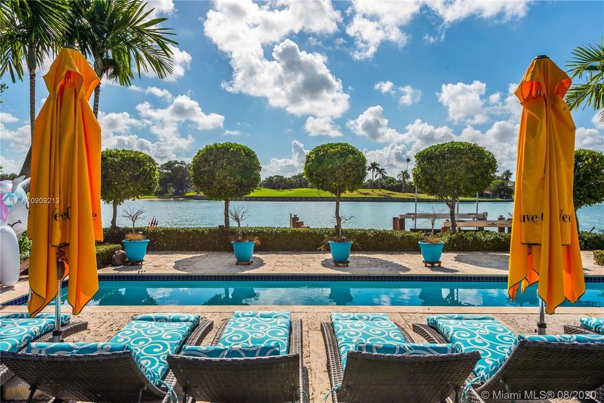 A truly special residence to call home! Experience peace, serenity & amazing sunsets w/unobstructed Bay & Indian Creek Golf Course views in coveted Bay Harbor Islands. Stunning Mediterranean Estate built in 2004, 7BD/5Full/2Half BA, 7,160SF/A/C incl guest cottage/per owner. Situated on a lush 16,406SF lot w/105’ waterfront, large dock w/24,000lb boat lift, deep water w/direct ocean access, 75' heated lap pool, covered lounge areas & dining w/summer kitchen. Magnificent foyer entrance w/double height ceiling, grand living w/fireplace, elegant formal dining, media room w/customized built-ins, gourmet kitchen,800+ bottle temp-controlled wine cellar, impressive 2nd story master suite w/french doors opening to oversized private terrace facing South showcasing panoramic Bay & Golf Course views.