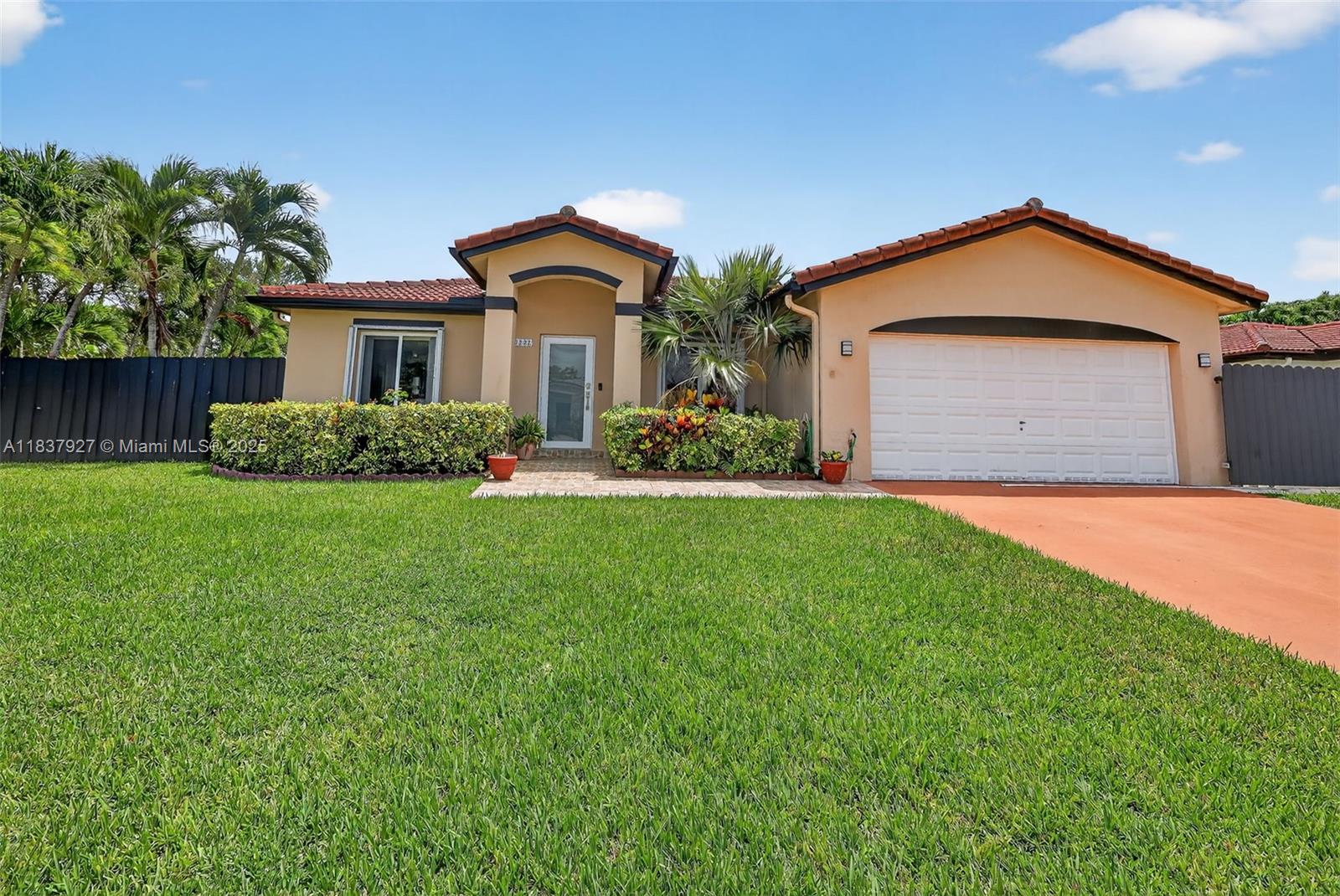 Welcome to your dream home in the heart of Cutler Bay! This beautifully maintained 3-bedroom, 2-bath residence sits on a spacious corner lot, offering a perfect blend of comfort, privacy, and functionality. Step inside to discover a bright open floor plan with ceramic tile throughout, great kitchen with view to the yard and sit-down counter, and spacious bedrooms with ample closet space. The large primary suite features an en-suite bathroom and direct access to the backyard. Enjoy outdoor living with a covered patio perfect for entertaining, a large fenced yard with room for a pool or boat, and lush tropical landscaping that enhances the home's curb appeal. Additional features include impact windows and doors, no HOA and an enclosed garage with an in-law quarters.