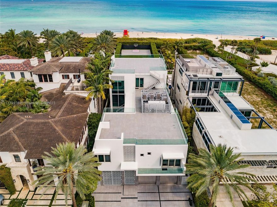 BACK ON THE MARKET - Enter to this exclusive home in the white sandy beaches of the Atlantic Ocean of Miami. The exclusive community of Altos Del Mar is centrally located surrounded by restaurants, minutes from the exclusive Bal Harbour Shops. This 3-stories+terrace offers the celebrity lifestyle, full amenities. 1st floor features home theater, bar, office, family room, floor-ceiling sliding glass doors opening to a summer kitchen, heated pool, jacuzzi, cabana, and large manicured fenced backyard with its own Basketball court. 2nd level grand entertaining room w/ fireplace, custom-built kitchen, wine cellar, walls of glass onto large terrace. A pathway leads you to the four bedrooms suite. 3rd floor owner master suite w/ a private terrace overlooking the ocean. DON'T MISS OUT.