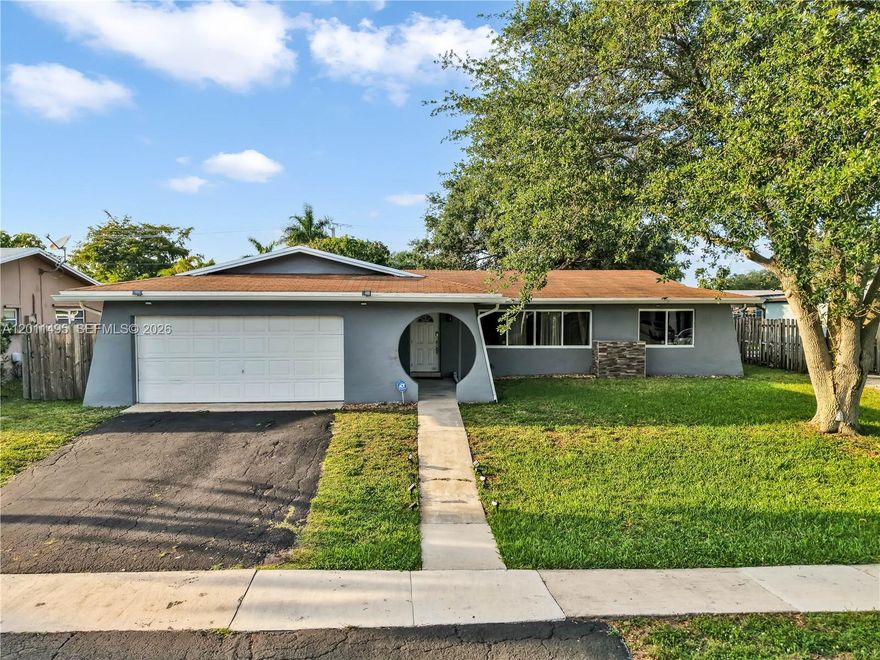 Open concept 3 Bed / 2 Bath + Extra Room home situated in the desirable community of Pasadena Lakes with NO HOA. This thoughtfully designed residence features a split-floor plan with generous living and dining areas, high-volume ceilings, and abundant natural light. The home showcases a custom open-concept kitchen, designed to seamlessly connect with the main living areas. This home is fully protected with high-impact doors and windows and offers peace of mind with a new A/C system (2022) plus new A/C ductwork & insulation (2023). A versatile extra room provides flexibility as a 4th bedroom, home office, or flex space. Home also shows an oversized primary suite with a large walk-in closet. Best of all the home is equipped with a large 2-car garage, a spacious covered terrace, and fenced backyard with room for a pool. Conveniently located just steps from parks, great schools, and nearby dining and entertainment. No HOA!