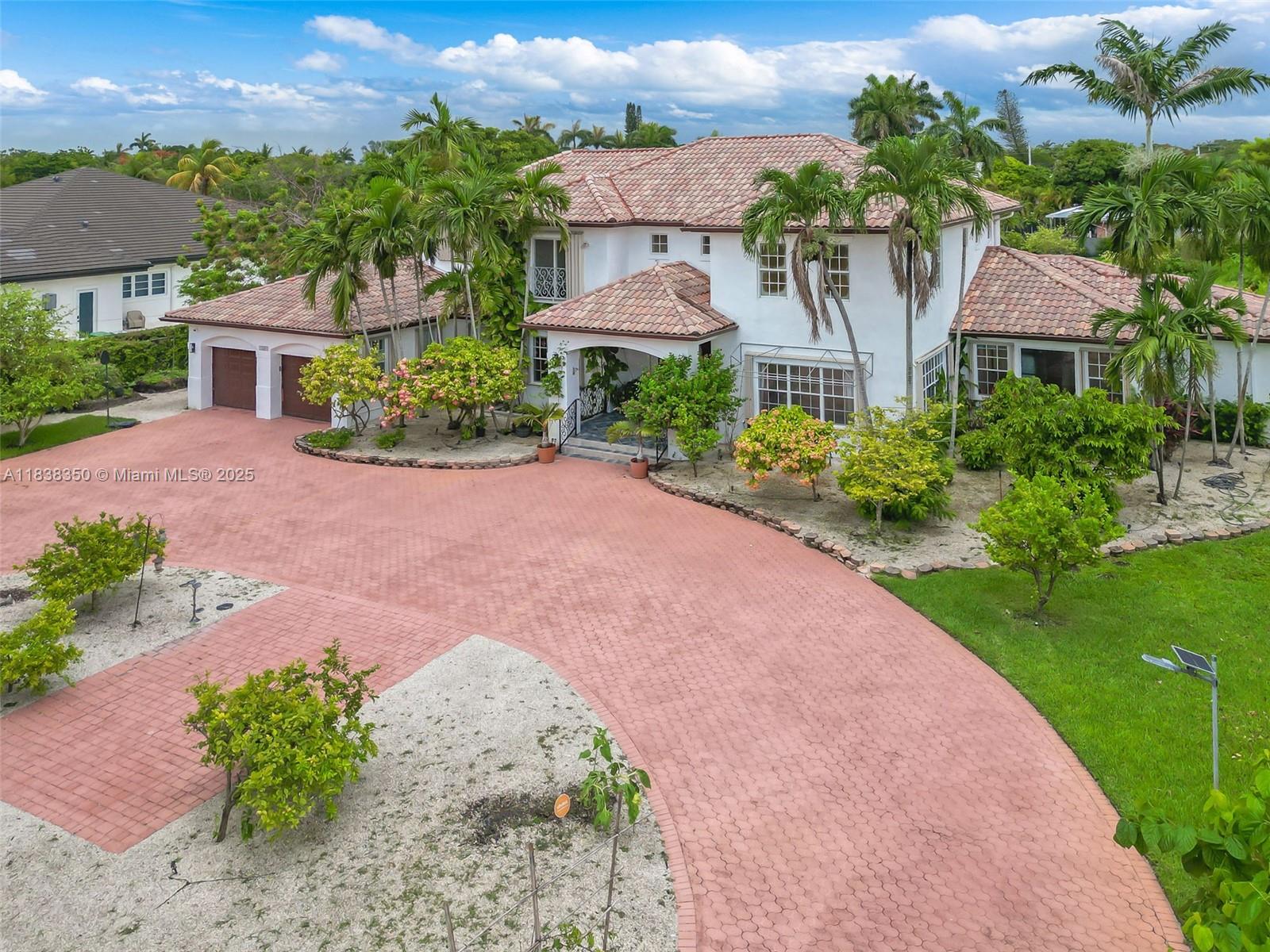 Beautifully maintained home on a corner lot (over 1 Acre). Home features 6 Bedrooms and 5 full baths, office/library, exercise room, enclosed patio with air conditioning, 3 central A/C units and many mature fruit trees (mango, papaya, guava, passion fruit and many more).
Land provides more than ample space to add additional structure if desired.