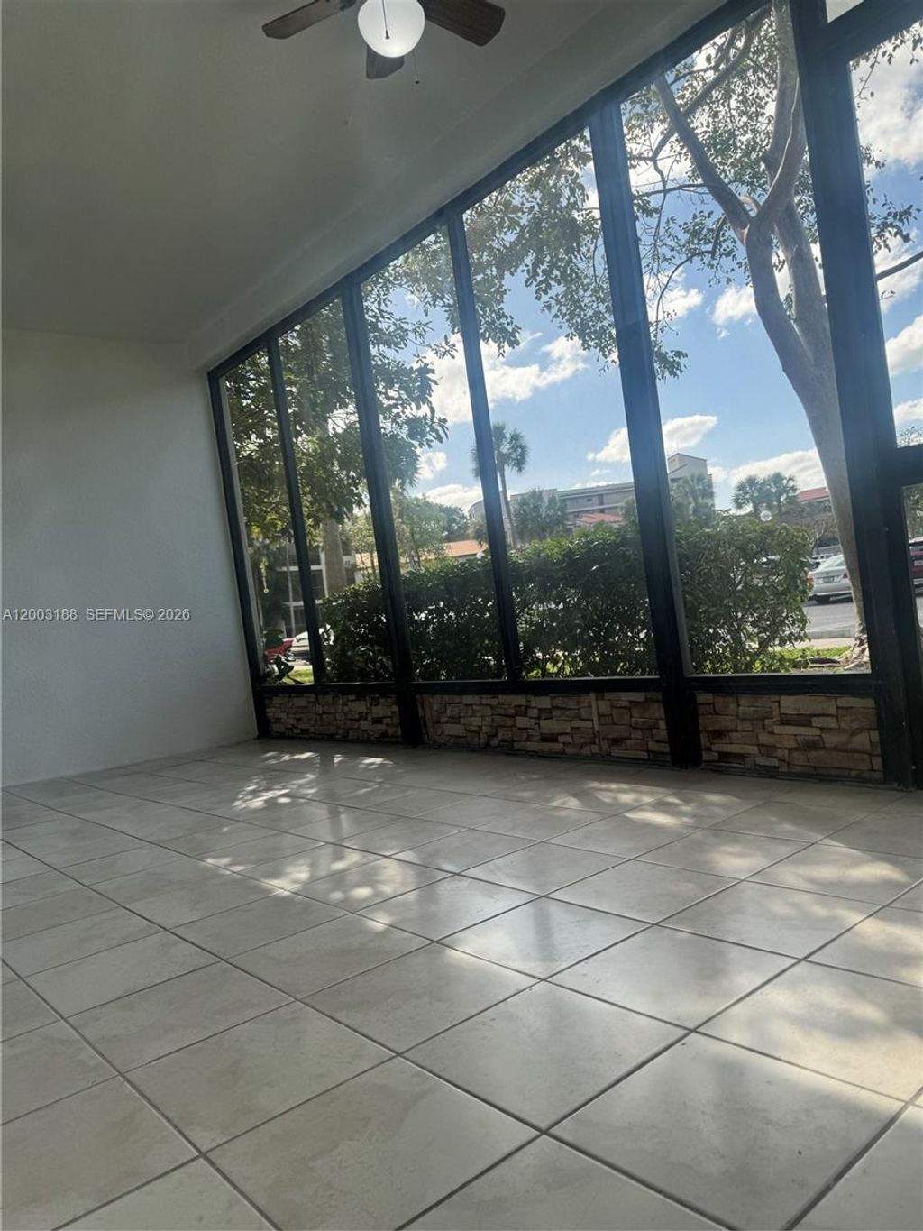 Photo of 2312 S Cypress Bend Dr #107, Pompano Beach, FL 33069 (MLS # A12003188)