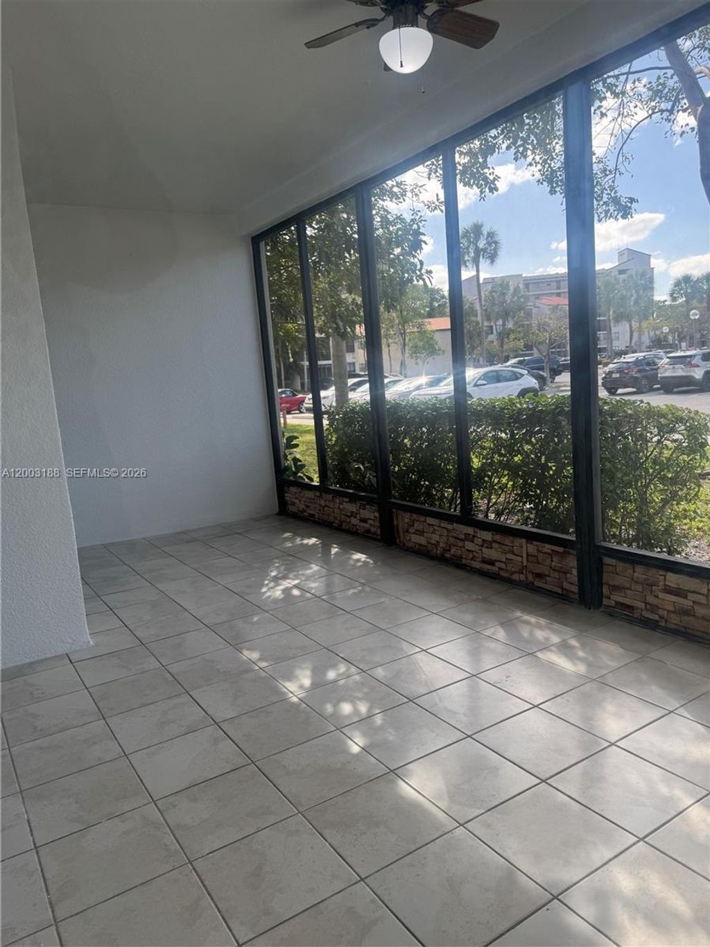 Photo of 2312 S Cypress Bend Dr #107, Pompano Beach, FL 33069 (MLS # A12003188)