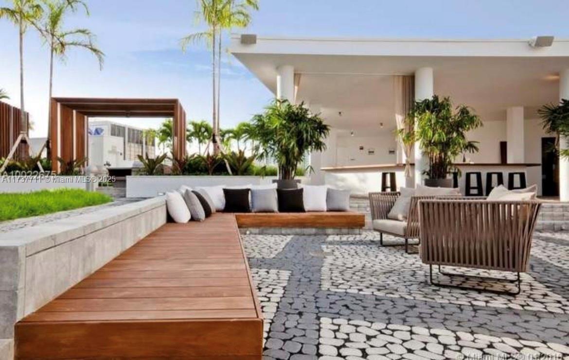 Beautiful two bedrooms and two bathrooms with amazing bay view from the living room and master bedroom. This building is like a resort with top amenities, including a heated infinity-edge swimming pool, heated sunset swimming pool, his an hers sauna and steam room, movie theater clubroom with a fully equipped kitchen and big-unscreen TV, billiard table, fitness center, spa with massage room, children's playroom, teen game room with arcade, concierge and valet parking. The building was designed by Lenny Kravitz. This unit has a private elevator, private foyer, 10 foot-high ceilings with floor to ceiling glass windows, an 8 foot-deep balcony with glass railing, in unit washer and dryer and top of the line kitchen appliances. Located in Edgewater.