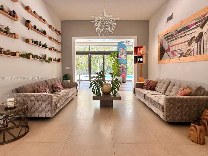 Sprawling 5,116 SF home on a 23,332 SF lot. Main house features 4 bedrooms, 4 baths, office and fully enclosed garage converted to a custom art studio/workshop. Soaring 12' ceilings, tons of natural light, and spacious kitchen that connects to open living spaces making it perfect for entertaining. Pool, avocado trees, and lush, private yard. Split bedroom plan, multiple flex spaces, ample storage, and parking. 
Separate 900 SF guest house with 2 bedrooms, 1.5 bathrooms, full kitchen, laundry and its own private gate entrance—ideal for rental income or in-laws. A rare opportunity to own a creative,  functional, and potentially income-generating retreat in a prime location! Priced to sell.