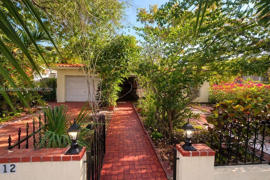 Spacious 5-bedroom, 3-bath home in historic Shenandoah Neighborhood. Perfect blend of "Old Miami" charm and modern versatility. On a 5,900 sq ft. lot, features flexible layout suitable for large families or potential rental income. The main living area (3BD/2BA) is bright and inviting, complemented by attached rear quarter (2BD/1BA) with its own entrance—suitable for an in-law suite or potential rental income. Enjoy gated front porch, lush gardens, and mature trees. Freshly painted interiors.  Move-In ready. Features attached 1-car garage, two separate parking spaces and spacious Florida room.  Unbeatable Location: Steps away from vibrant culture of Calle Ocho, just minutes from Downtown, Brickell, Coconut Grove, Coral Gables, and Miami International Airport. Don't miss out!