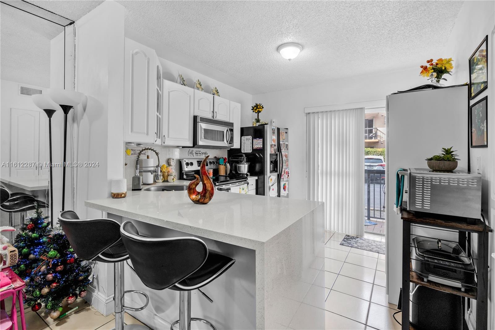 Discover modern living in this 2-bedroom, 2-bathroom apartment located in the heart of Hialeah, Florida. Newly remodeled kitchen with stainless steel appliances awaits, complementing the spacious living area flooded with natural light. Conveniently situated on the first floor, enjoy easy access to local amenities and entertainment options. Don't miss this opportunity for luxury living in a prime location! Schedule your showing today. No reserves, buyer must come in with 25% down. New roof less than 1 year, seller has paid Special Assessments in full.