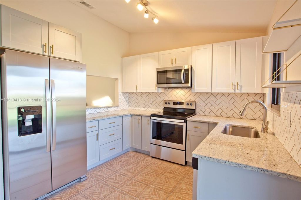 Photo of 625 SW Jeanne St, Port Saint Lucie, FL 34953 (MLS # A11619418)