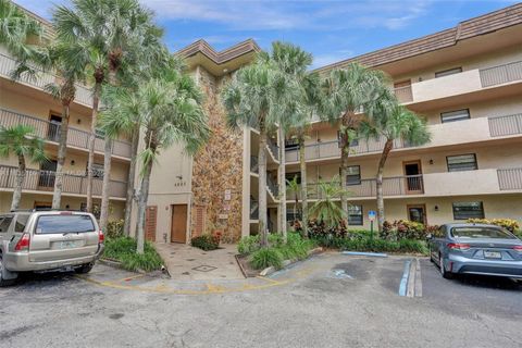 Photo of 4965 E Sabal Palm Blvd #207, Tamarac, FL 33319 (MLS # A11835159)