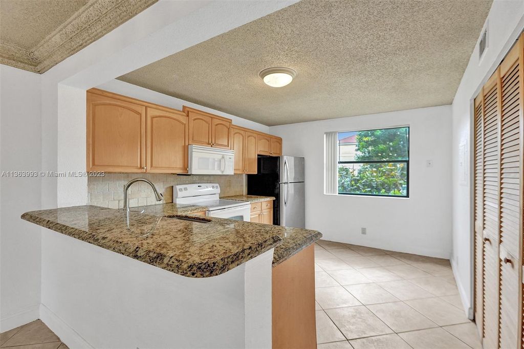 Photo of 5681 Riverside Dr #101A6, Coral Springs, FL 33067 (MLS # A11363993)