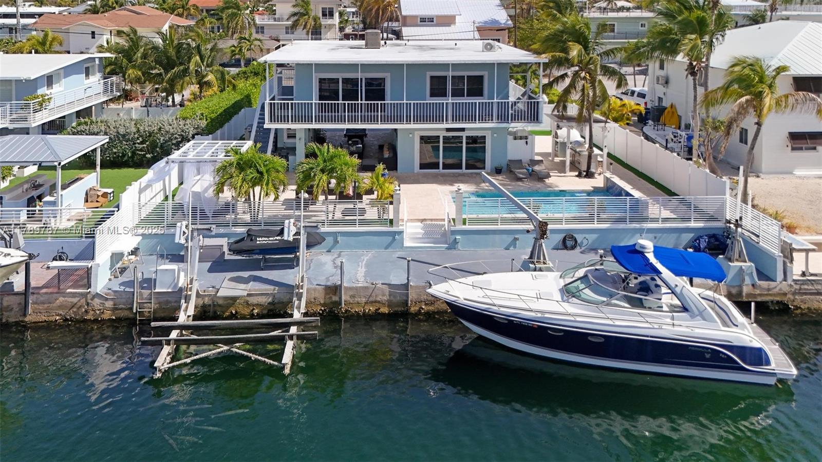 Discover this fully furnished 4BD/4.5BA home offering the perfect blend of style, comfort, and Florida Keys charm. Enjoy elegant tile flooring, updated bathrooms, and a modern kitchen with stainless steel appliances—ready for your next gathering. Step outside to your private tropical oasis, which features a sparkling pool, spacious patio with BBQ area, and a pizza oven, perfect for entertaining. Enjoy peace of mind with impact doors and windows, a concrete flat roof, gated entry, privacy fencing, and a complete security system.
Located in desirable Port Largo, this home is just a short ride from the community boat ramp, public park, tennis and pickleball courts, and community pool. It is also close to dining and shopping, and only an hour from Miami—this home truly has it all.