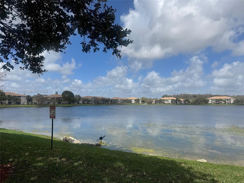 Photo of 5065 Wiles Rd #103, Coconut Creek, FL 33073 (MLS # A12011260)