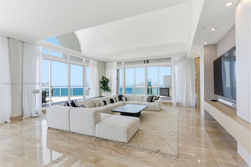 RARE TWO-STORY PENTHOUSE IN SUNNY ISLES. An exceptional opportunity to own a fully reimagined residence in Oceania IV, just minutes from Bal Harbour and Aventura. This expansive two-story penthouse offers over 4,150 SF of living space, featuring 4 bedrooms and 4 full bathrooms and 1 half bath, all designed with a modern, elevated aesthetic. Step inside to soaring ceilings, custom lighting, and floor-to-ceiling views capturing the ocean, bay, and city skyline from every room. The open-concept kitchen is outfitted with custom cabinetry and top-of-the-line Sub-Zero & Wolf appliances, seamlessly connecting to the main living spaces - perfect for entertaining at the highest level. Every detail has been thoughtfully curated, from the custom blinds to the clean, contemporary finishes throughout. This is a true turnkey penthouse experience in one of Sunny Isles’ most sought-after buildings. This is more than a home - it’s a statement.
