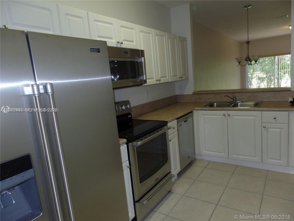 Photo of 14055 SW 49th St #6, Miramar, FL 33027 (MLS # A12031495)