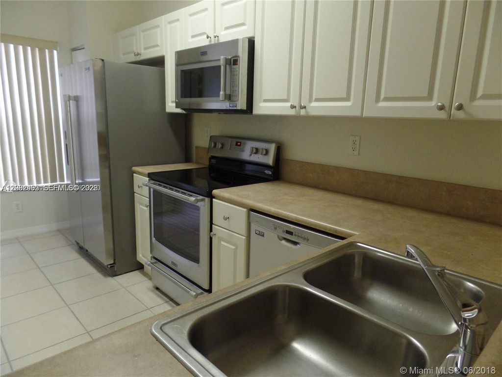 Photo of 14055 SW 49th St #6, Miramar, FL 33027 (MLS # A12031495)