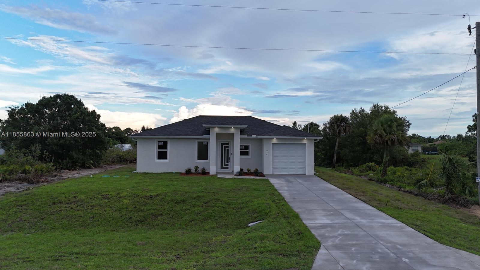 **Brand-new construction home in thriving Lehigh Acres! This 3-bedroom, 2-bath home features an open-concept floor plan with high ceilings, porcelain tile flooring, and impact windows and doors. The bright kitchen showcases quartz countertops and stainless-steel appliances, seamlessly connecting to the spacious living and dining areas. The master suite offers a spacious walk-in closet and a modern bathroom designed for comfort. Additional highlights include a one-car garage for secure parking and extra storage. Built outside the flood zone for added peace of mind. Colors and materials may vary based on availability. Don’t miss this incredible opportunity — easy to show and ready for move-in! Schedule your tour today and come see this beautiful property!!