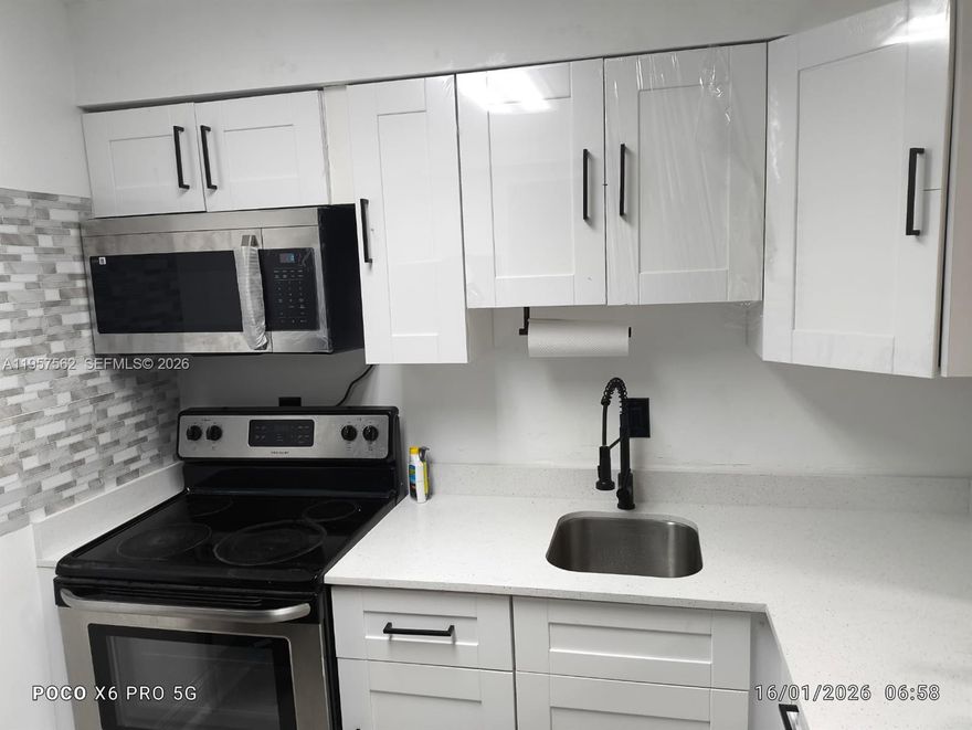 Spectacular and turnkey unit, perfect for savvy investors seeking high rental demand or first-time homebuyers looking for a modern, move-in-ready property. This residence has been thoughtfully upgraded, featuring brand-new contemporary flooring throughout and a stunningly remodeled kitchen. The kitchen boasts sleek, new cabinetry paired with elegant white quartz countertops, providing a high-end feel.The property is situated in a privileged location with immediate access to major highways, including the Palmetto Expressway and SR-736, ensuring seamless commuting. Residents will enjoy being just steps away from the vibrant Downtown Doral area, renowned for its world-class international dining, luxury shopping, and cultural entertainment. Additionally, the unit is zoned for A-rated, top-tier schools, significantly enhancing its long-term value and appeal.