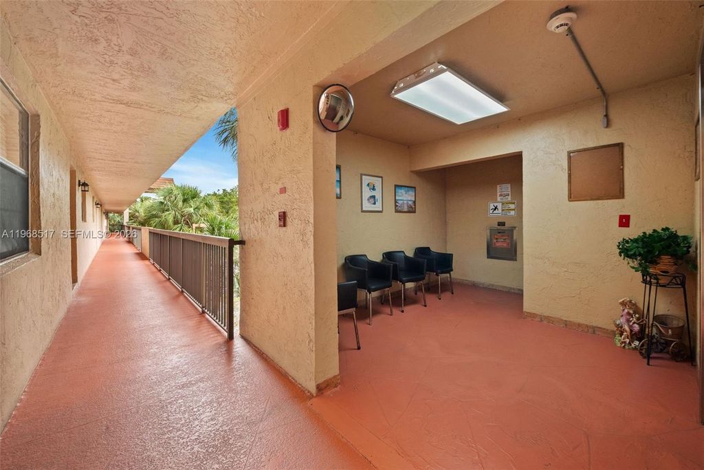 Photo of 4950 E Sabal Palm Blvd #310, Tamarac, FL 33319 (MLS # A11968517)