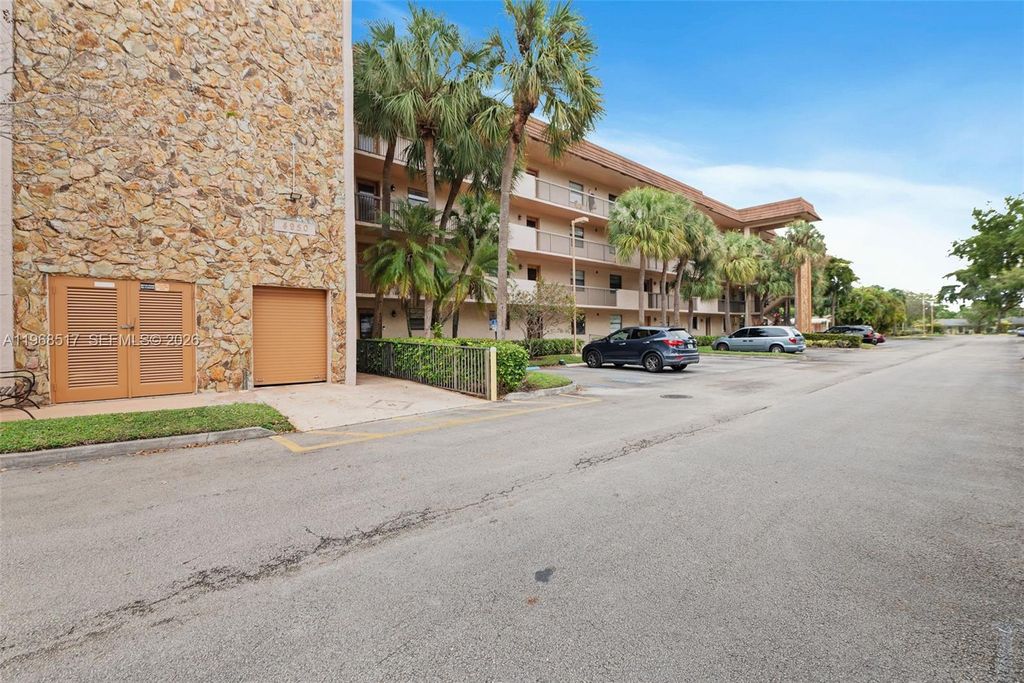Photo of 4950 E Sabal Palm Blvd #310, Tamarac, FL 33319 (MLS # A11968517)