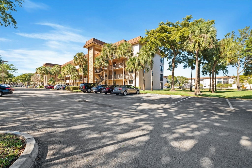 Photo of 4950 E Sabal Palm Blvd #310, Tamarac, FL 33319 (MLS # A11968517)