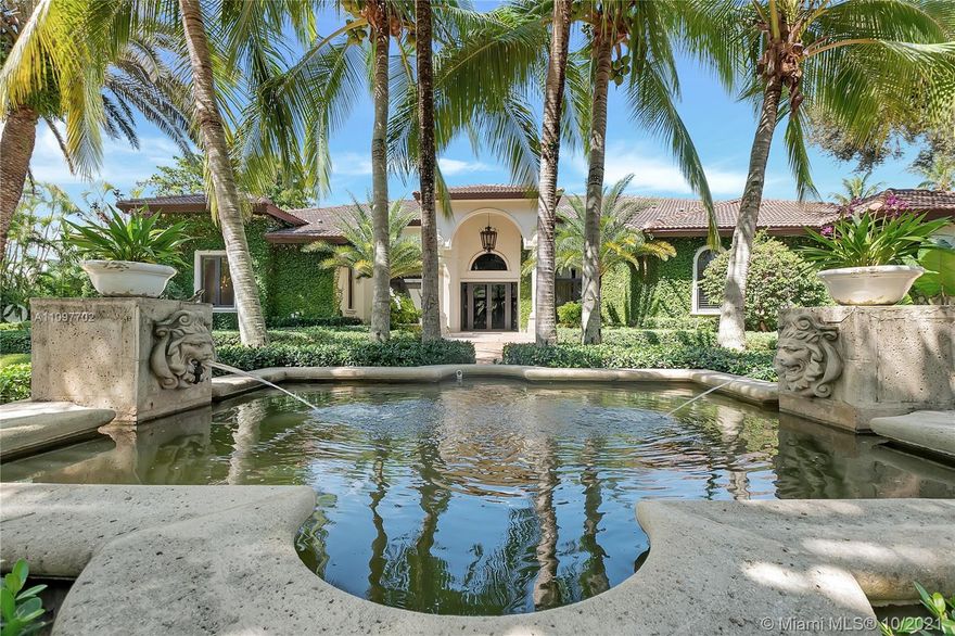 Prominent gated residence on palm-lined street in north Pinecrest. One-story estate features soaring ceilings & great distribution of space. Manicured backyard is a SoFL oasis with luxe pool/spa area, summer kitchen, koi pond, grassy area for playing & mature privacy trees. Dine-in chef’s kitchen for entertaining opens to breakfast nook & large family room.  Enjoy covered al fresco dining and your summer kitchen. Elegant pool and decking invite you outside.  Huge master w/sitting room. Top-line finishes and features include impact windows/doors, whole-house generator, new garage doors, new lighting system, new closets, repainted on the interior, new exterior cameras, new A/C units & new washer/dryer/dishwasher. Top-rated Pinecrest Elementary school district and easy access to shops & US-1.
