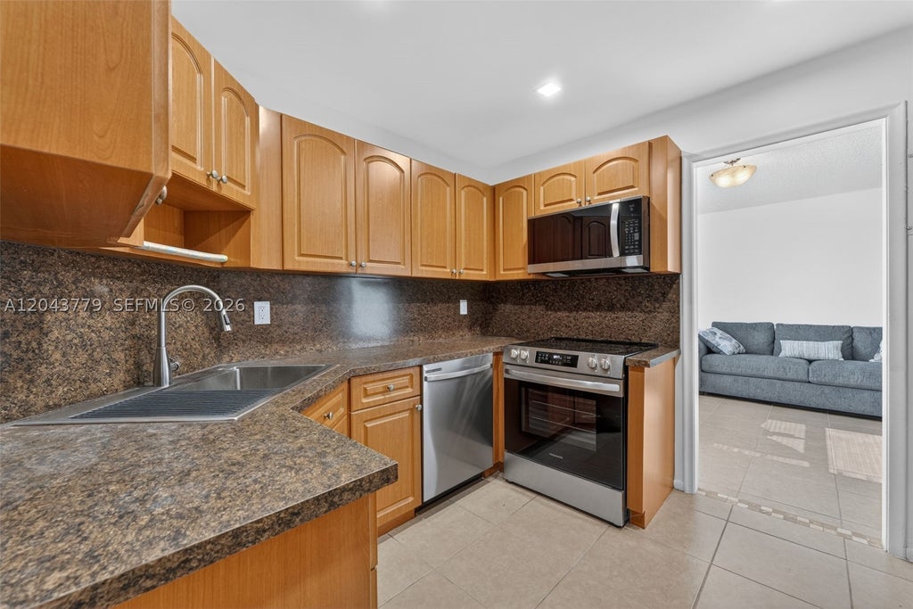 Photo of 3301 Spanish Moss Ter #405, Lauderhill, FL 33319 (MLS # A12043779)