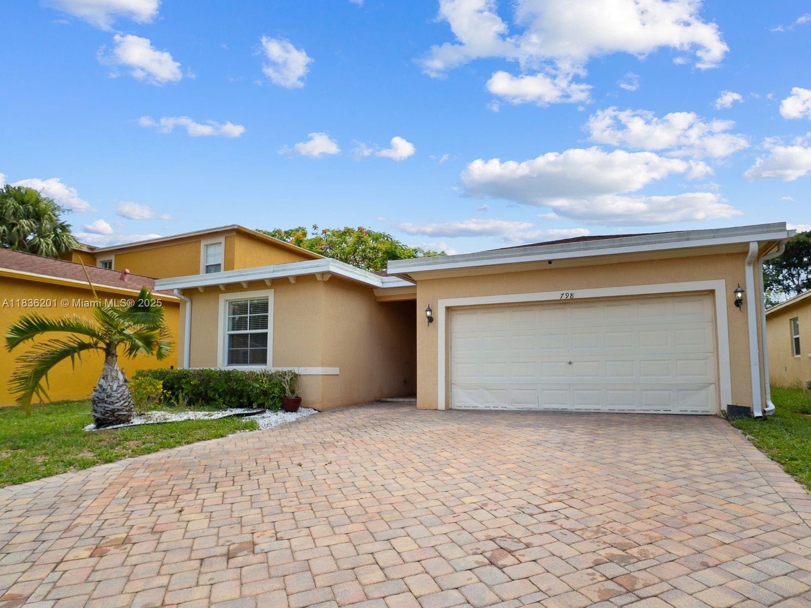 BEAUTIFUL 3 BEDROOMS 2 BATHROOMS SINGLE-FAMILY HOME WITH 2 CAR GARAGE IN THE AMAZING COMMUNITY OF SUNTERRA IN HEART OF THE CITY OF WEST PALM BEACH! PERFECT TURN-KEY HOME FOR INVESTORS OR IDEAL FOR FIRST-TIME HOME BUYERS! HOME FEATURES: SHINGLE ROOF, BEAUTIFUL BATHROOMS, SPACIOUS PRIMARY BEDROOM WITH DUAL SINK AND WALKING CLOSET, BEAUTIFUL KITCHEN WITH NICE CABINETS, STAINLESS-STEEL APPLIANCES, SEPARATE LAUNDRY WITH WASHER AND DRYER, SPACIOUS FRONTYARD WITH CLEAN GRASS, NICE BACKYARD GREAT FOR ENTERTAINMENT... HURRY! THIS ONE WONT LAST!