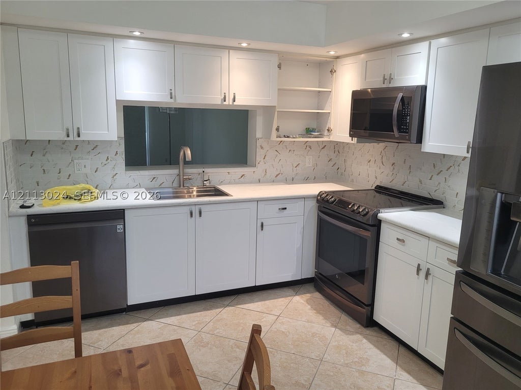 Photo of 1200 SW 130th Ave #207G, Pembroke Pines, FL 33027 (MLS # A12113024)
