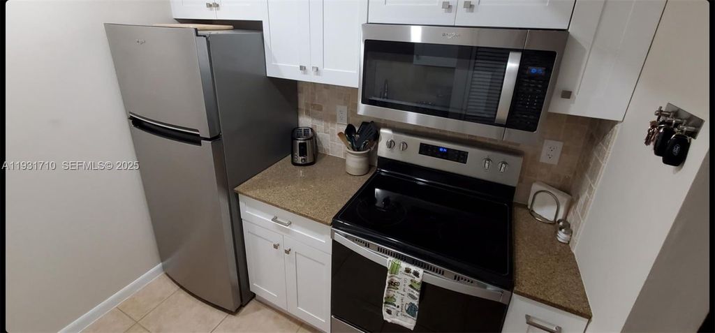 Photo of 4110 NW 88th Ave #101, Coral Springs, FL 33065 (MLS # A11931710)