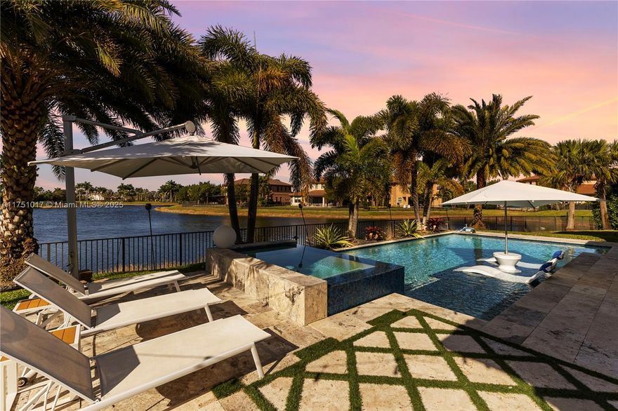 Bring your toothbrush and move right into this stunning 9-year-old pool/lakefront home! Enjoy breathtaking sunsets from this 5-bedroom plus den 5.5-bath residence spanning 4,212 sq. ft. on a pie shape premium lot.
The outdoor oasis includes a custom pool & fully equipped summer kitchen, built just 6 years ago. With over $200K in upgrades, this home offers luxury and comfort throughout. Built in 2016 provides worry-free peace and of mind. Gas connection for kitchen, summer kitchen, water heater & pool heater
Resort-style community with two clubhouses, a state-of-the-art fitness center, sports courts, including tennis, volleyball, basketball, and racquetball. With top-rated A+ schools and low HOA fees, this is the perfect place to call home.
Be sure to explore the Virtual 3D Tour!