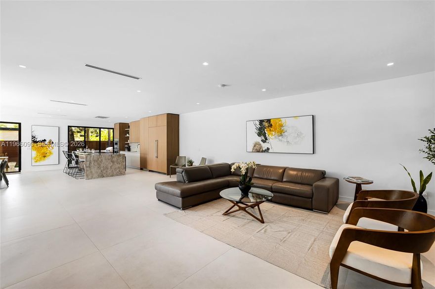 This fully finished, move-in ready modern home is perfectly positioned on a corner lot in the heart of Buena Vista. With approximately 4,200 total square feet and a large 7,200 sqft lot, the home offers open, light-filled spaces and a clean contemporary design with high-end finishes throughout. You’re welcomed by an impressive 8’ x 6’ pivot door that opens to 48in x 48in Spanish porcelain floors, a custom made kitchen with an oversized island, Taj Mahal quartzite countertops, and Thermador appliances. A sleek floating staircase with modern railings adds a striking design touch. Upstairs you will find a large Family room with built in TV and wall panels for entertaining and next to it you will find a 600 soft roof terrace with views of the city and ample space to relax in the sun. Every bedroom includes its own ensuite bath with custom closets and hidden hinged doors for a seamless look. The primary suite feels like a private retreat, complete with a balcony and a spa-style bathroom featuring a soaking tub, separate shower, dual vanities, and a private water closet with a smart toilet. Outside, enjoy a fully fenced backyard with a heated saltwater pool and spa with full automation, summer kitchen, and lush landscaping—perfect for entertaining or relaxing. Plus, the property is not located in a flood zone!