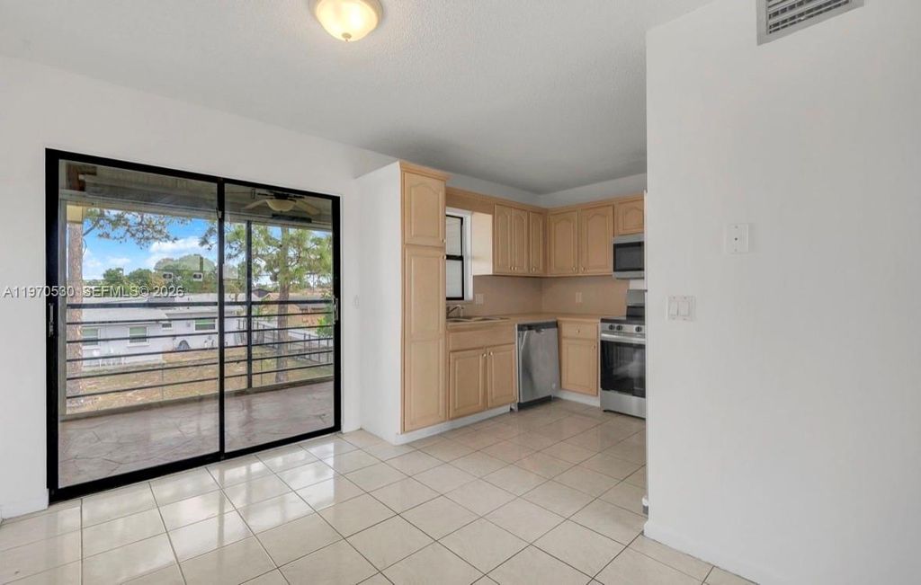 Photo of 5894 Longbow Ln #6, West Palm Beach, FL 33415 (MLS # A11970530)