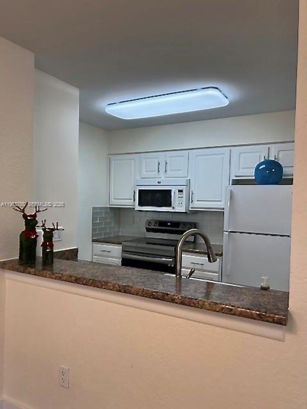 Photo of 2811 N Oakland Forest Dr #102, Oakland Park, FL 33309 (MLS # A11962788)