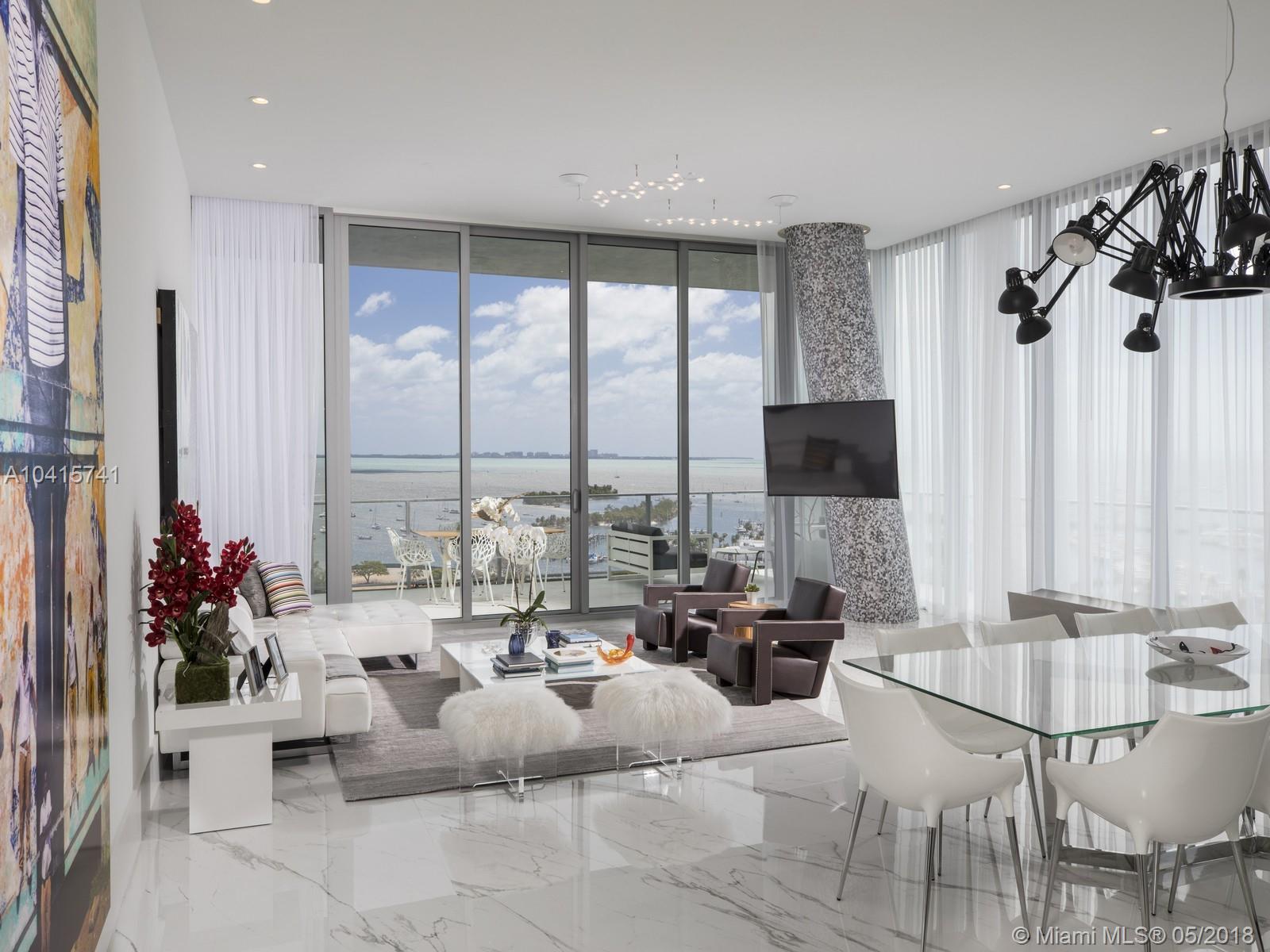 Custom 3 bedroom/4.1 bath corner unit located on the 12th floor of the iconic Grove at Grand Bay’s South Tower. The Grove’s most popular “Twisted Towers” was designed by renowned Danish architect Bjarke Bundgaard Ingels. 12 ft wide terrace with summer kitchen wraparound to display amazing panoramic unobstructed views of Biscayne Bay, Grove Harbour Marina and Miami city skyline. Kitchen features wine cooler, Miele fridge, gas cook top, double oven and built-in espresso station. Master suite complete with 2 ensuite full baths, walk-in closet with built-ins to accommodate his and hers with ease. Amenities include spa, private elevator foyer, restaurant, gym and 24 hr concierge. 2 Parking spaces and storage included. Walking distance to restaurants and shops. Designed by Carmen Alcaraz Gomes.