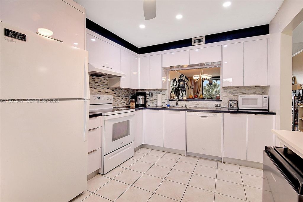 Photo of 1100 Colony Point Cir #302, Pembroke Pines, FL 33026 (MLS # A11987947)