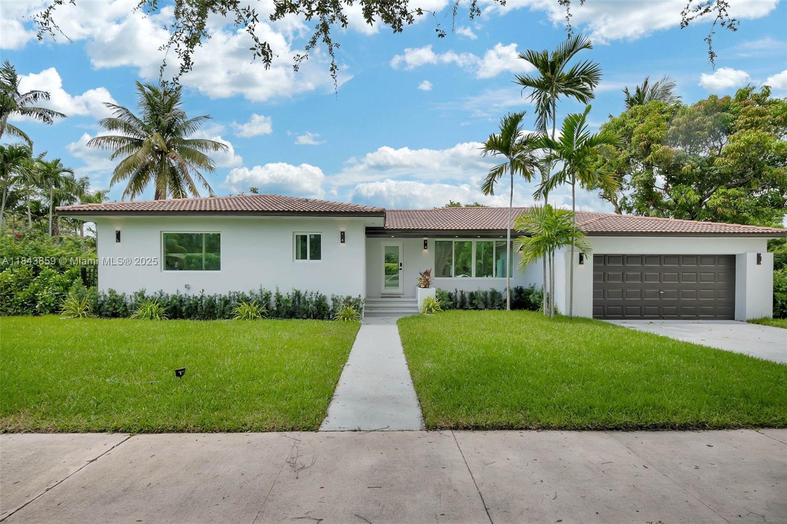 Step inside this exceptional Miami Shores residence, where style meets comfort in a true prime location. Offering 2467 sqft of living area, 4 bed / 3.5 bath, 2 car garage plus a gorgeous and meticulously designed pool area. Showcasing custom/high-quality carpentry work in all closets and kitchen. Amazing pool views all around the house. Soaring vaulted 9.5 ft ceilings and stunning real engineered hardwood floors throughout. The home features all-new plumbing, electrical systems, A/C ducts, brand new 2-zone AC system, high impact windows and doors. Every square foot of this home has been masterfully utilized, offering a well-balanced layout that delivers comfort and functionality. Designed for seamless indoor/outdoor living, the home is set on a 13614 sqft huge corner lot. Near A+ schools.