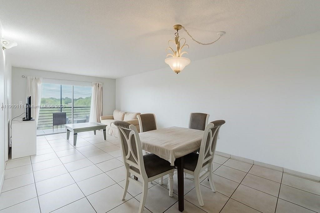 Photo of 3110 N Pine Island Rd #409, Sunrise, FL 33351 (MLS # A11910111)