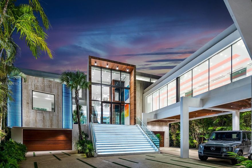 Stunning Bay/Canal Contemporary Residence- 100+ ft on deep water - New Construction (total of 12,924 SF under A/C).  Loaded with ultra luxury finishes and very little use - 35KM solar electric generator w/six Tesla power walls & Travertine exterior walls.  All custom lighting & sound throughout.  Unique glass elevator to all three levels.  Generous sized rooms and large closets.  Art Gallery, Office-Library, amazing 12 car garage, play room & wine cellar.  Breathtaking views of the Open Bay, City lights and tropical gardens from all rooms.  Huge covered Patio + Summer Kitchen w/50ft infinity edge pool.  Full dock & Boat Lift. Double gated 24/7 Island in the heart of Miami.  Minutes to Design District, Beaches, Downtown Miami & Bal Harbour.  Owner Financing Available.