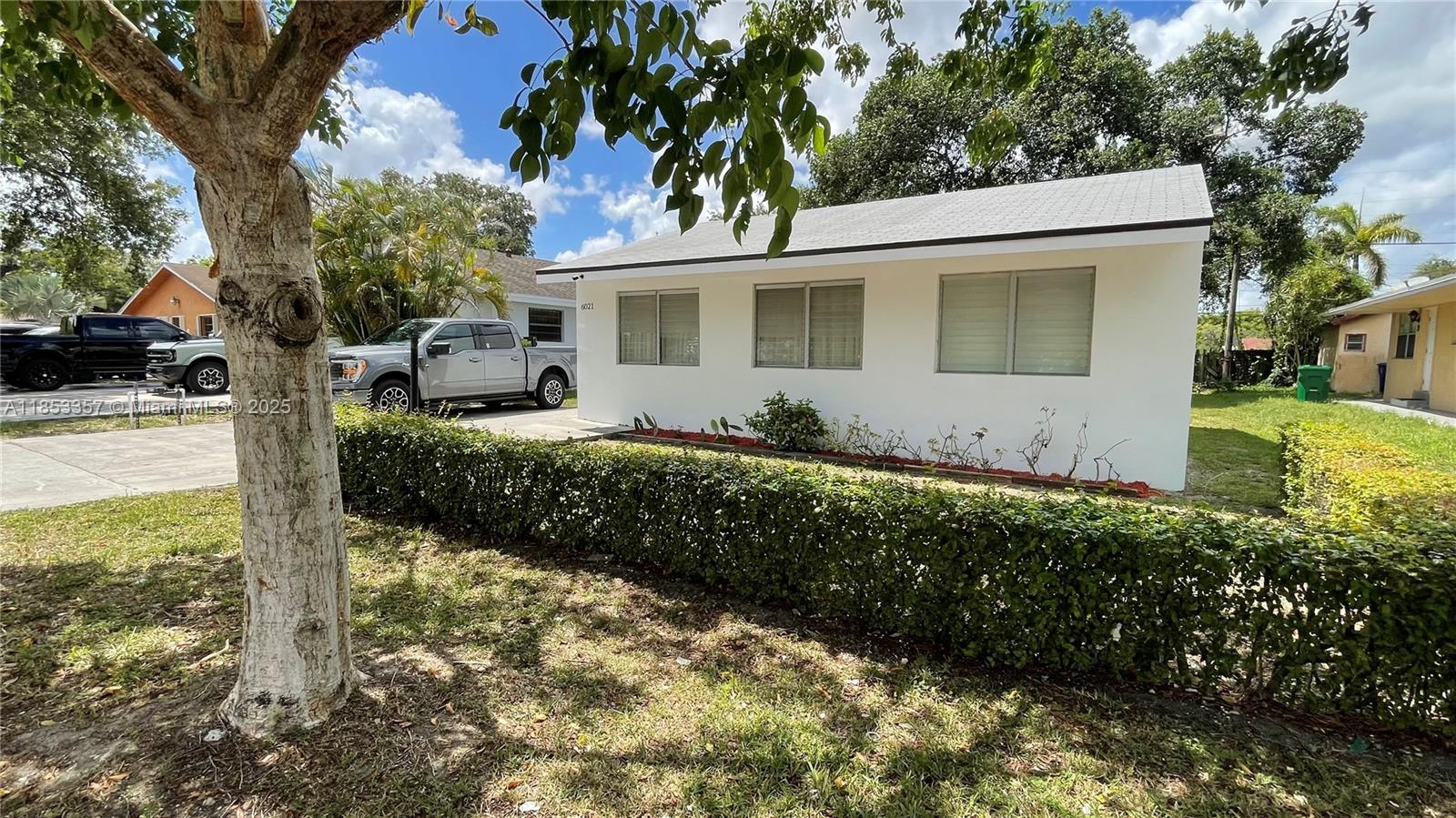 BEAUTIFUL HOUSE RECENTLY UPDATED 2 BEDROOM / 1 BATHROOM remodeled kitchen with wood cabinets and granite counter tops stainless steel appliances new water proofed laminate floors on all house Aluminum hurricane shutter protection in all windows NEW CENTRAL ACO ROOF 2021 remodeled bathroom freshly painted inside and outside GREAT INVESTMENT PROPERTY OR GREAT RENTAL PROPERTY WITH BEAUTIFUL LANDSCAPING YARD BIG ENOUGH FOR BOAT SPACE OR RV AND PLENTY OF DRIVEWAY PARKING LOTS OF POTENTIAL STILL NO HOA FEES CLOSE TO MAIN AVENUES AND HIGHWAYS AND SHOPPING CENTERS LOCATED IN A GREAT QUIET NEIGHBORHOOD HOUSE READY TO MOVE IN AND LIVE IN