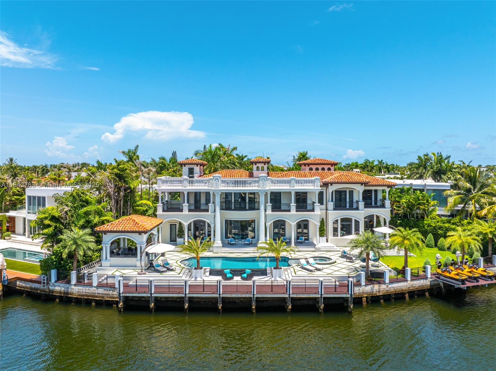 Stunning modern Mediterranean castle in the illustrious Golden Beach, positioned in one of the neighborhood's quiet cul-de-sacs. This legacy estate boasts 200 ft of prime Intracoastal water frontage with rare long water views. The property encompasses nearly 20,000 sq ft, with almost 10,000 sq ft of luxurious living space behind private gates that open to breathtaking curb appeal. Experience unmatched quality with the finest finishes throughout, embodying Italian grandeur and a warm, homey ambiance. Pristine water views are visible from nearly every room, making this home a magnificent creation in one of the best locations.
