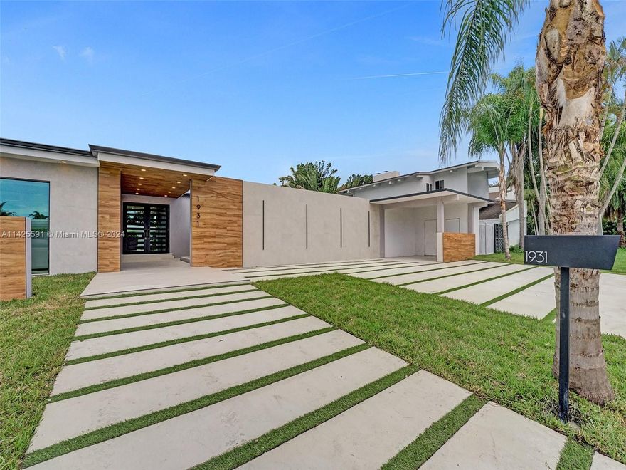 STUNNING 5BR/4.5BA property boasting 2970 Sq Ft. This is a single-story gem offers an array of features: kitchen (indoor & outdoor). The interior is secure and inviting with impact windows. The laundry room is fully equipped. Exterior highlights include pool, extra storage, outdoor bar, open porch, 8-car garage, and small covered garage. All on a 13,000 Sq Ft lot. Landscaping that frames the entire property and the pool is stunning. Pets allowed, no association.