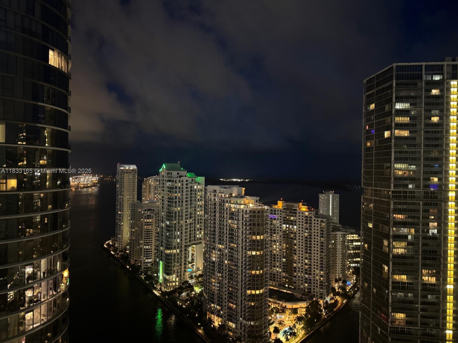 Experience upscale living in this stunning 2 bed / 2 bath unit featuring soaring 11-foot ceilings. The split floor plan offers spacious bedrooms and a luxurious master bath. Enjoy breathtaking views of the Miami River, Fisher Island, Brickell Key, and South of Fifth from this high-rise haven. Gourmet kitchen equipped with premium Sub-Zero and Miele appliances. Indulge in on-site fine dining at Zuma, relax by multiple resort-style pools, or unwind at the spa located on the 16th floor. Includes 1 covered parking space.