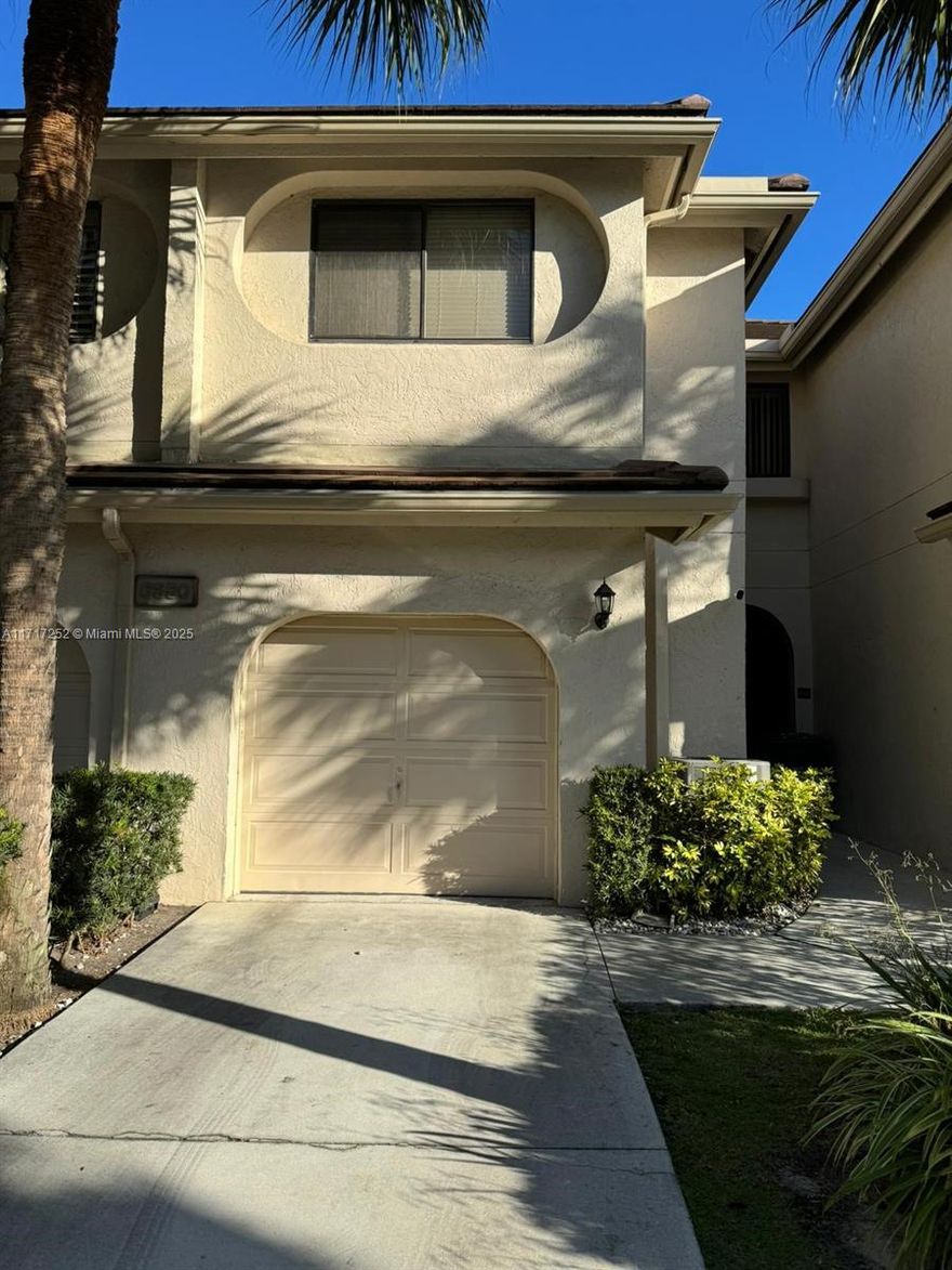 Spacious Town-home in a highly desirable Boca neighborhood. Nicely appointed features with updated electrical panel, large enclosed back patio and a spacious kitchen with stainless steel appliances. The TWO smaller bedrooms were converted into ONE large bedroom with ample closet space and can be reverted by adding a wall. Large master bedroom with walk-in closet and bathroom with working Jacuzzi for your relaxation. Seller will contribute 6 months of HOA with full priced offer.