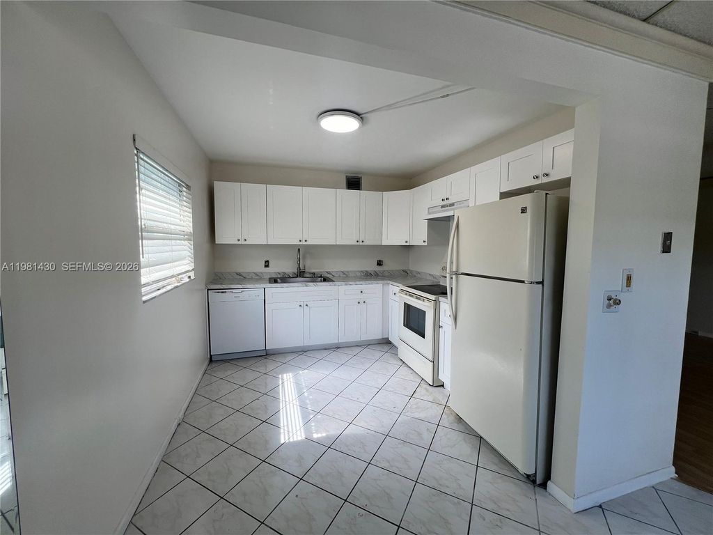 Photo of 850 SW 133rd Ter #201B, Pembroke Pines, FL 33027 (MLS # A11981430)