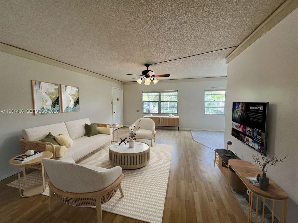 Photo of 850 SW 133rd Ter #201B, Pembroke Pines, FL 33027 (MLS # A11981430)