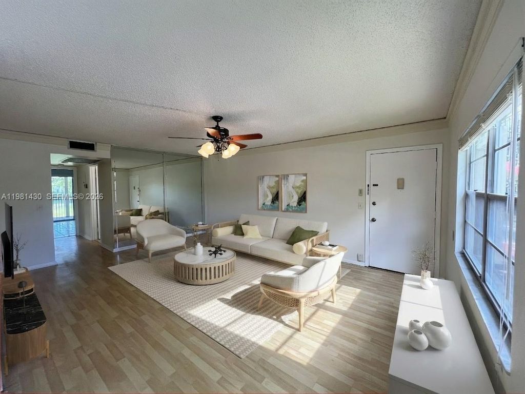 Photo of 850 SW 133rd Ter #201B, Pembroke Pines, FL 33027 (MLS # A11981430)