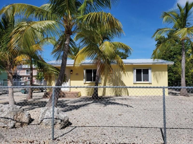 Escape to your own slice of paradise in this fully furnished 2-bedroom, 1-bath single-family home, perfectly situated on a private canal with direct ocean access. Whether you’re a boating enthusiast, a fishing lover, or just craving peaceful waterfront views, this home delivers it all.
Enjoy the convenience of your own private boat launch and dock—ideal for setting out on fishing trips, snorkeling nearby reefs, or simply soaking in unforgettable sunsets.
Inside, the home offers a bright and inviting open living and dining area filled with natural light. The kitchen is fully equipped with modern appliances and plenty of counter space, making mealtime a breeze. Every room is tastefully furnished and move-in ready, so you can relax and feel right at home from day one.