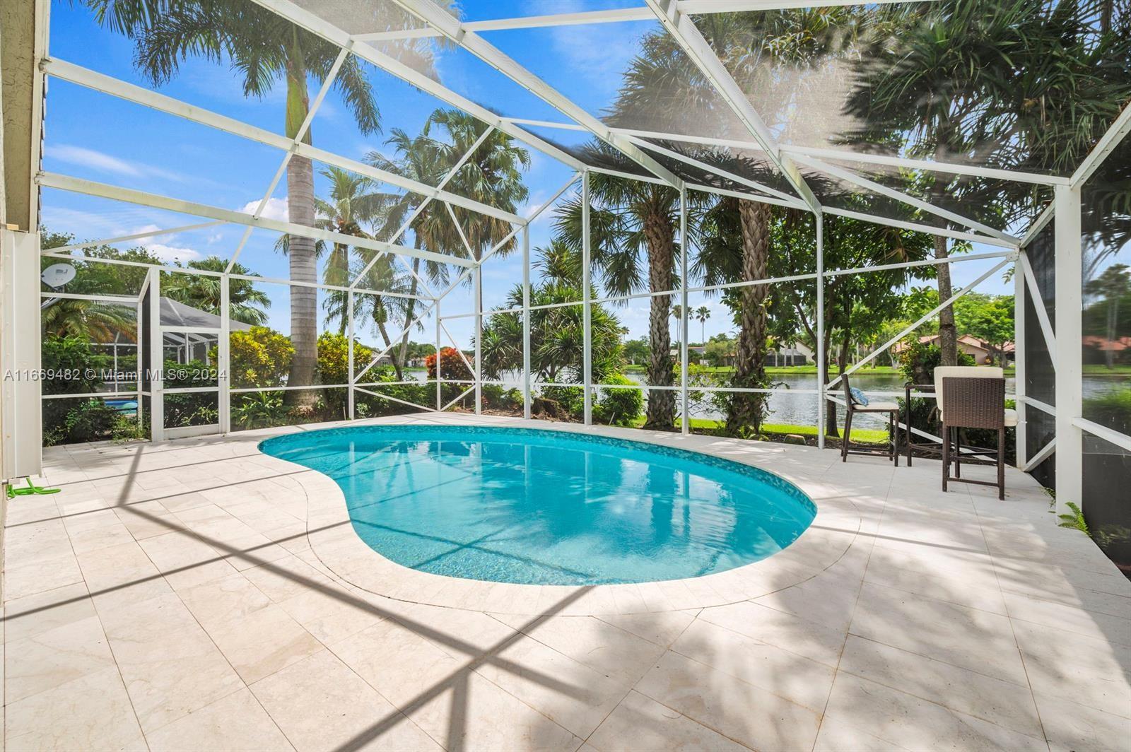 Amazing Remodeled house 3/3 plus a bonus room, very well located with a screened pool (pool recently redone) on a wide lake in gated community, Newer Roof and AC, IMPACT WINDOWS. Within walking distance of Country Isles Park, Weston Town Center. THIS IS A MUST SEE..........